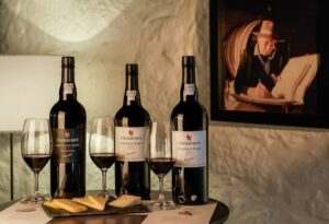 Porto: Cockburn’s Port Lodge Tour and Tasting - Inside the granite cellars: barrels, vats, and coopers