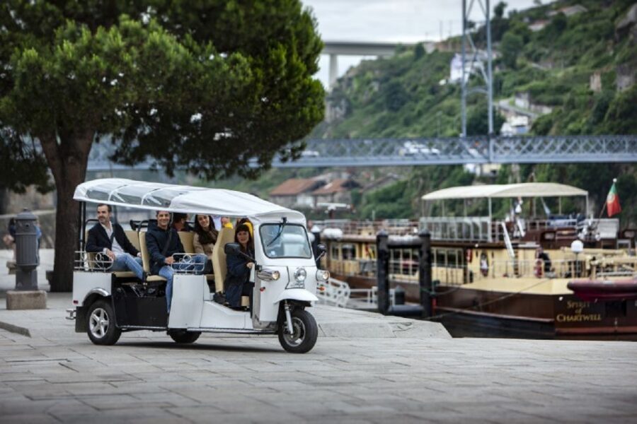 Porto: Private Sightseeing Tour by Electric Tuk Tuk - Palácio da Bolsa: old merchant power you can sense nearby