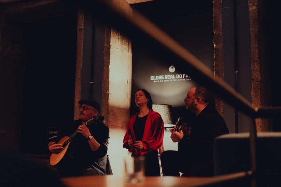 Porto: Traditional Fado Show with Welcome Drink - Entering Clube Real do Fado Near Clérigos Tower