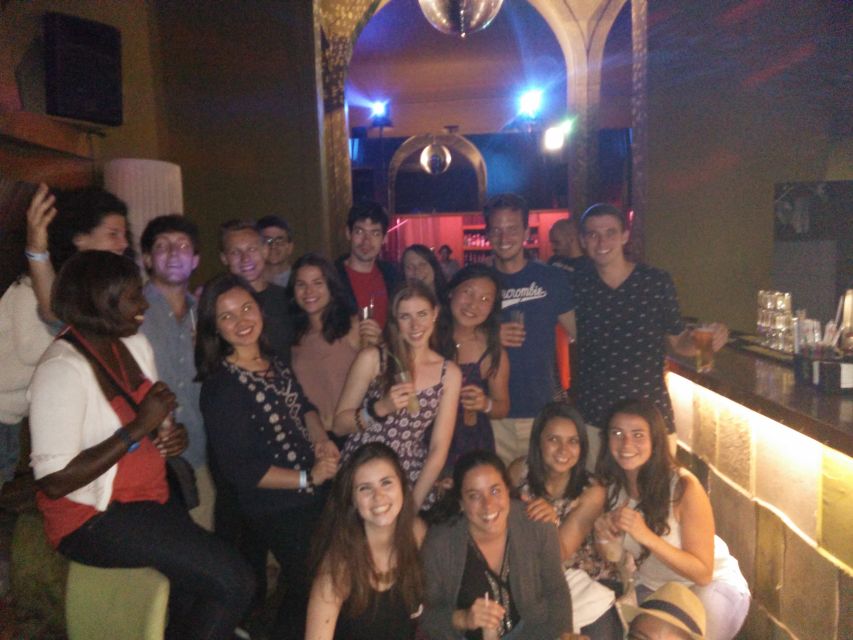 Porto: Pub Crawl with 6 Drinks and VIP Club Entry - Porto at night with the red umbrella start at 10:30 pm