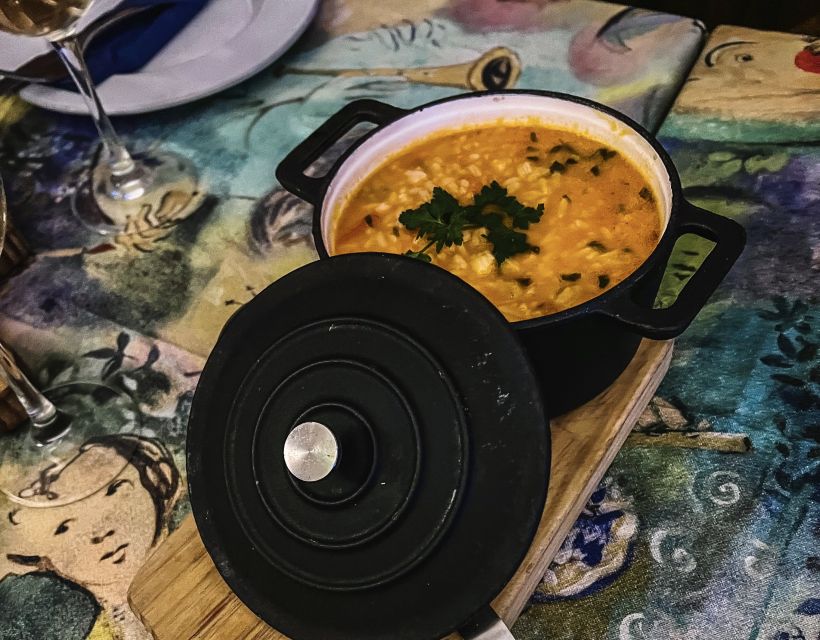 Porto: Walking Dinner Tour with Family-Owned Restaurants - The family-run tasca stop and the green wine moment