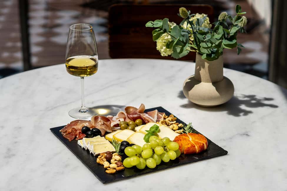 Porto Wine Tasting Experience with Portuguese Tapas Plate - Portuguese tapas pairing: cheese, cured ham, jams, and crackers